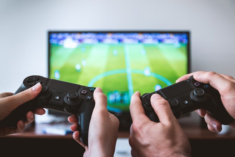 Video game controllers on a surface, illustrating a platform fighting game update