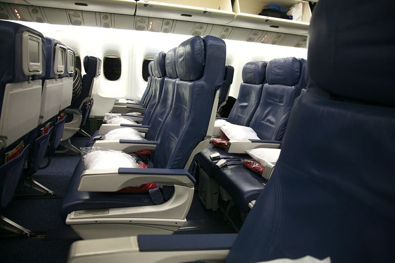 Rows of economy class seats inside a Delta Air Lines Boeing 767-400ER cabin