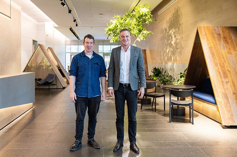 UK Science Secretary Peter Kyle standing with a man in the lobby of Anthropic's San Francisco office, the company that develops Claude Code