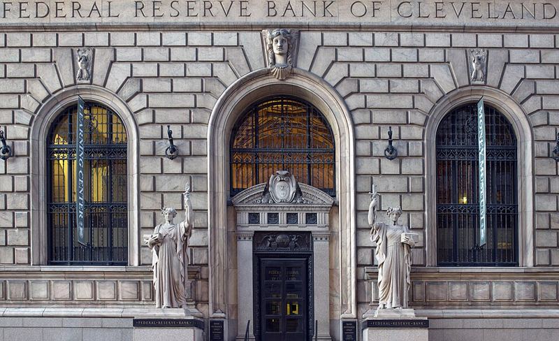 Stone facade and arched entrance of the Federal Reserve Bank of Cleveland