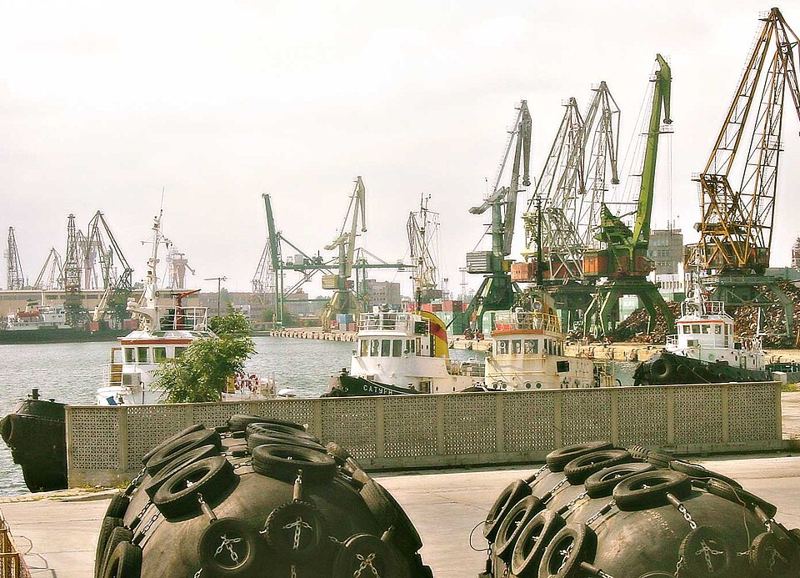 Cranes and tugboats at the Port of Varna East on Bulgaria's Black Sea coast