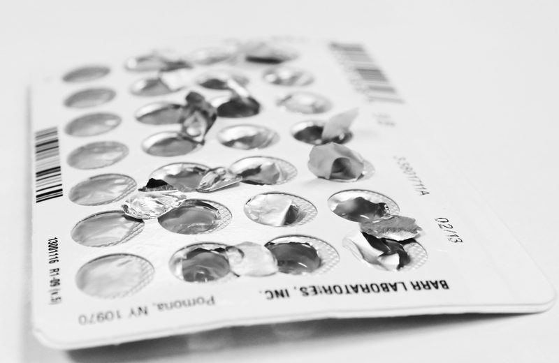 An opened blister pack of oral birth control pills