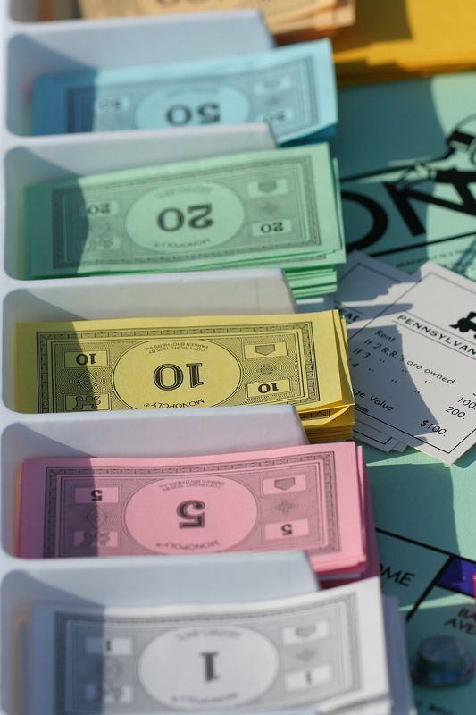 Stack of colorful Monopoly play money bills