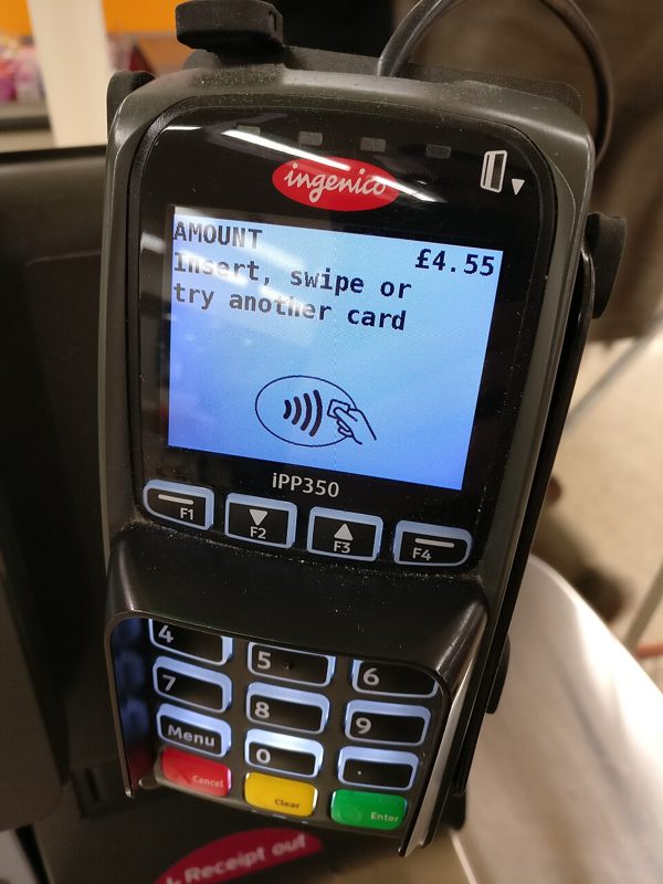 Card payment terminal screen asking the customer to insert, swipe or try another card