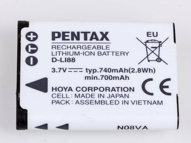 Spare lithium-ion camera battery pack on a white background