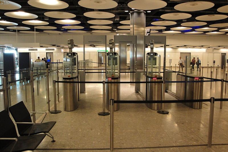 A row of automated ePassport gates in the arrivals hall at Heathrow Terminal 5