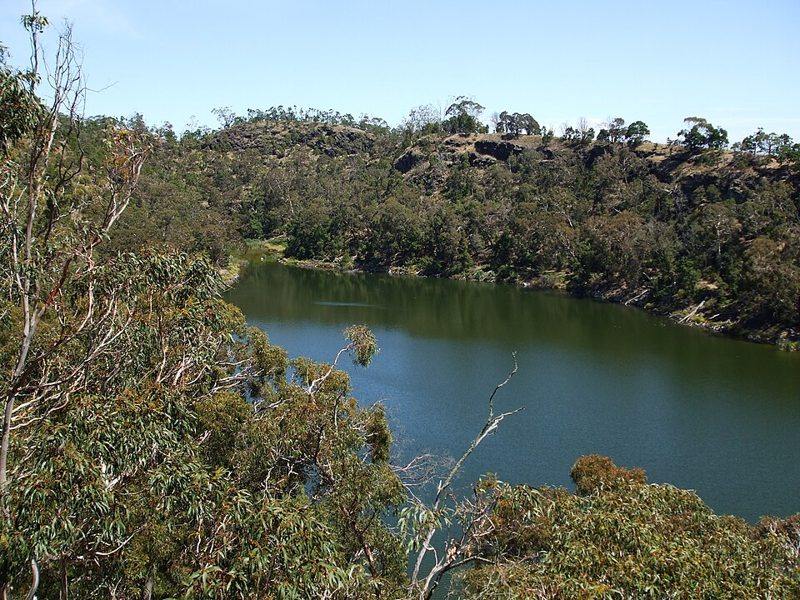 Crater lake surrounded by eucalyptus forest at Budj Bim in Victoria, Australia