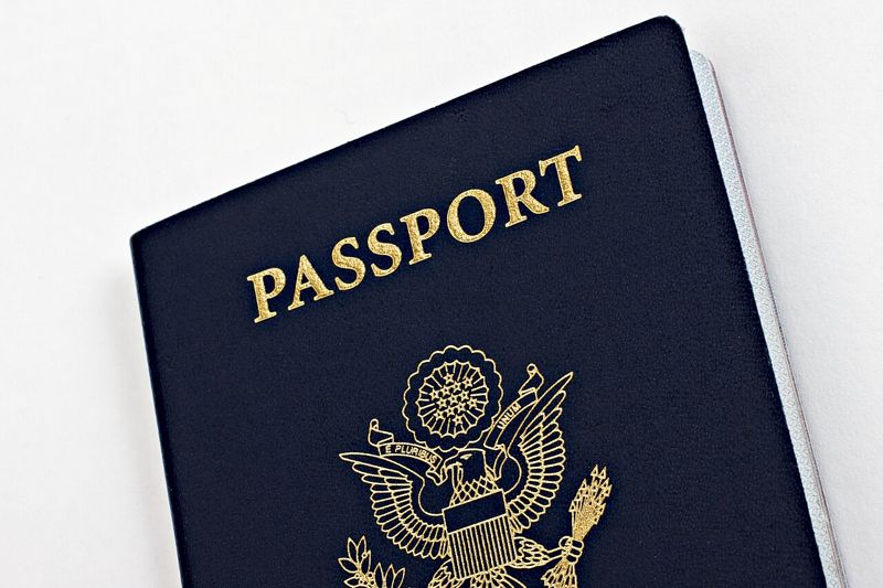 Dark blue United States passport book with gold lettering and eagle seal