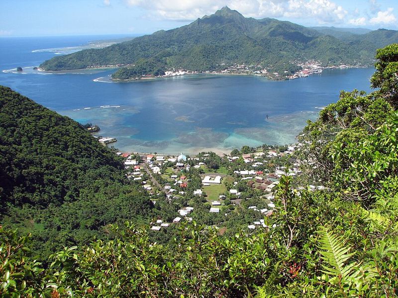 View from a forested ridge over Pago Pago Harbor and a village on Tutuila, American Samoa