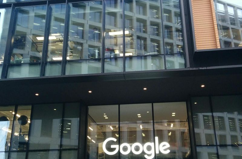 Glass entrance of the Google and Google DeepMind building at 6 Pancras Square in London, home of Gemini 4 Argon developer Google DeepMind