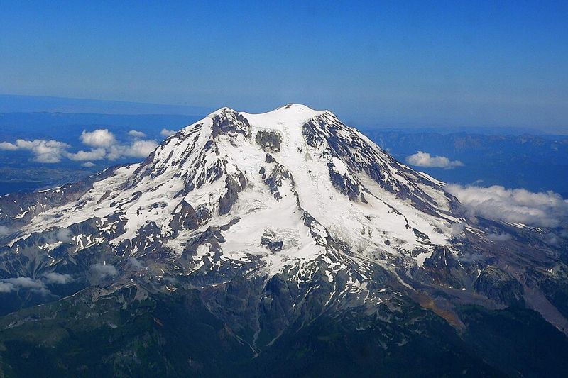 Snow-covered Mount Rainier, a Cascade Range volcano formed above the Cascadia subduction zone, seen from the west