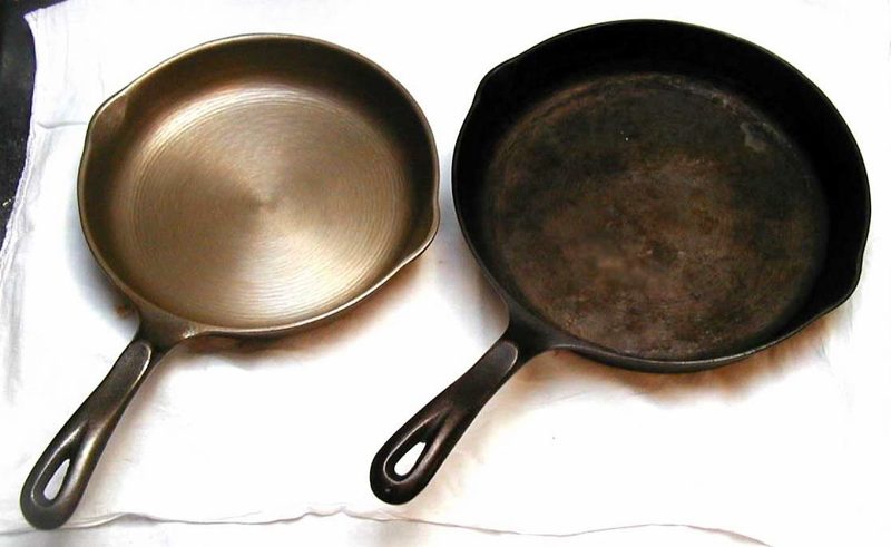 Two cast iron skillets side by side on a white cloth