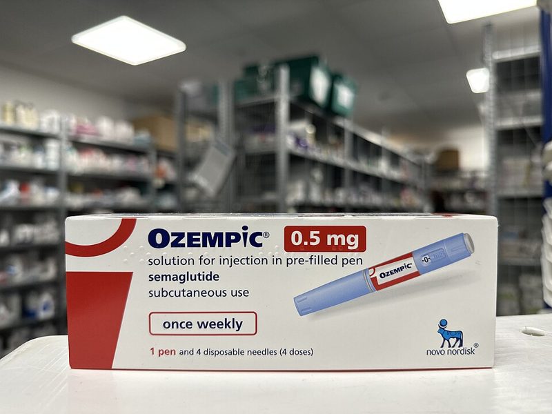 Box of Ozempic 0.5 mg semaglutide pre-filled injection pen on a pharmacy counter