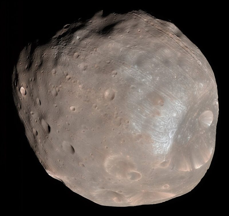 Color image of Phobos, the larger moon of Mars, showing its grey cratered surface and the large Stickney crater