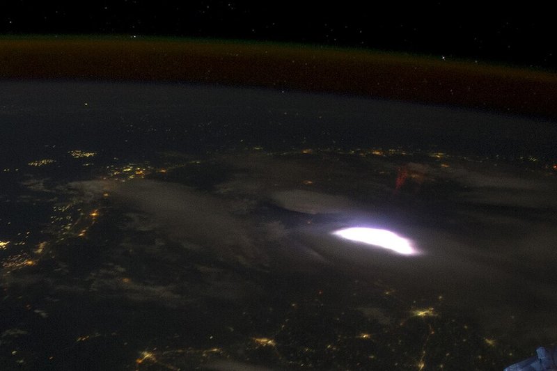 Red sprite above a thunderstorm, photographed from the International Space Station