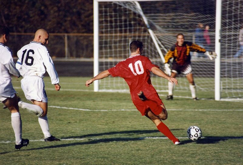 Players contesting the ball in a soccer match