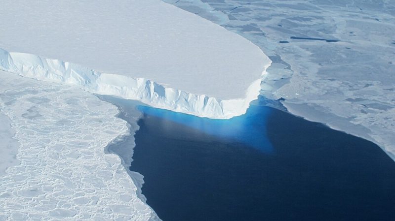 The ice front of Thwaites Glacier meeting dark ocean water in West Antarctica