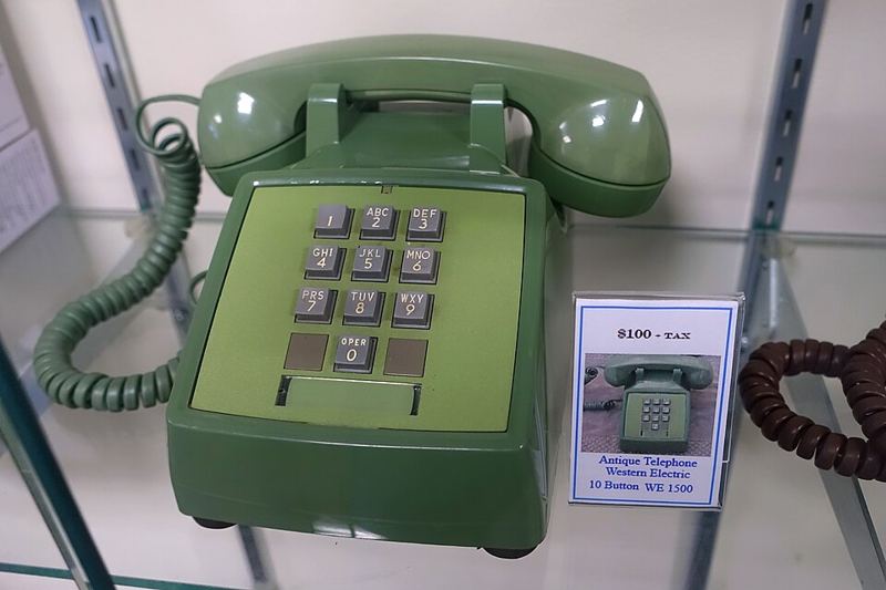 Green Western Electric WE 1500 push-button telephone with 1-2-3 keys on the top row