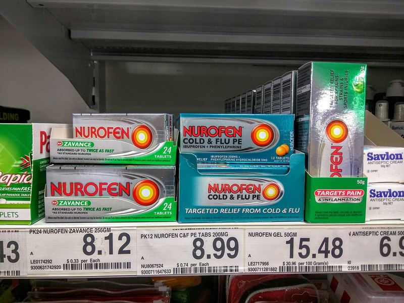 Packs of Nurofen ibuprofen tablets on a pharmacy shelf