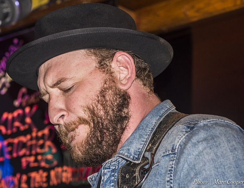 Blues guitarist Josh Smith performing at a club