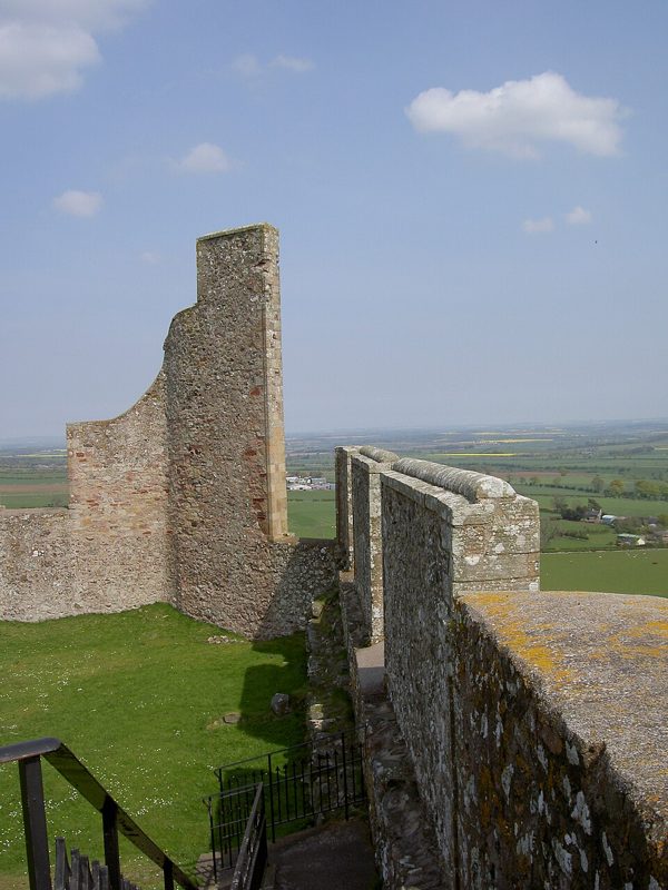 Crenellated stone wall walk at Hume Castle in the Scottish Borders, with farmland beyond