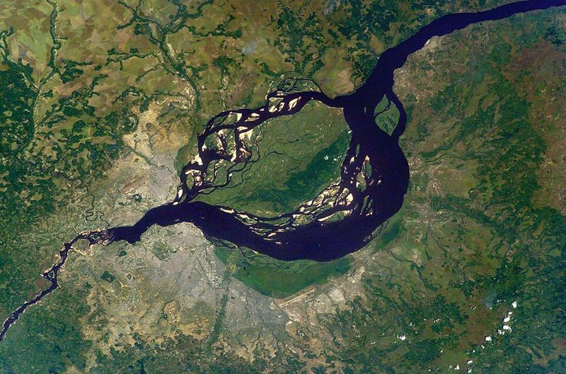 Astronaut photograph of the Congo River widening into Malebo Pool, with the cities of Kinshasa and Brazzaville on opposite banks