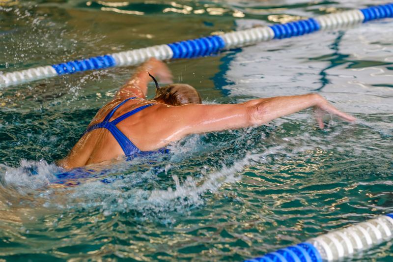 Swimmer performing the butterfly stroke in a pool