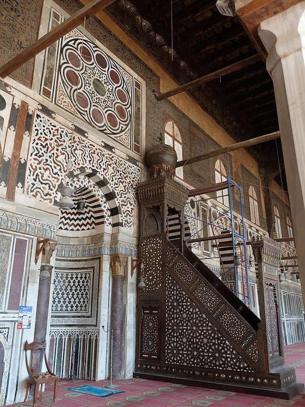 Marble mihrab niche and carved wooden minbar pulpit inside the Al-Muayyad Mosque in Cairo