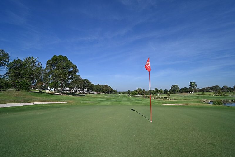 Golf flag on a putting green on a sunny day