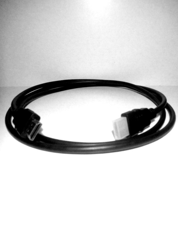 Black HDMI cable coiled on a surface