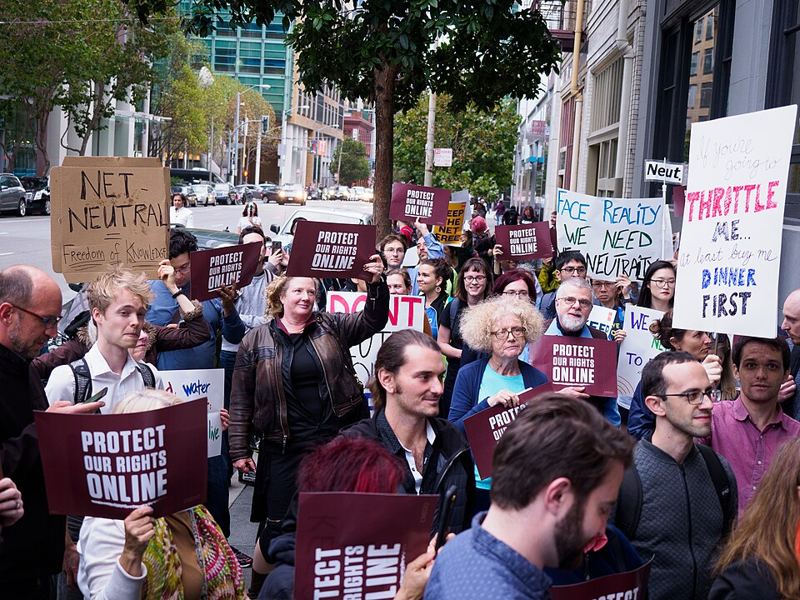 Demonstrators holding Protect Our Rights Online and net neutrality signs at a rally in San Francisco