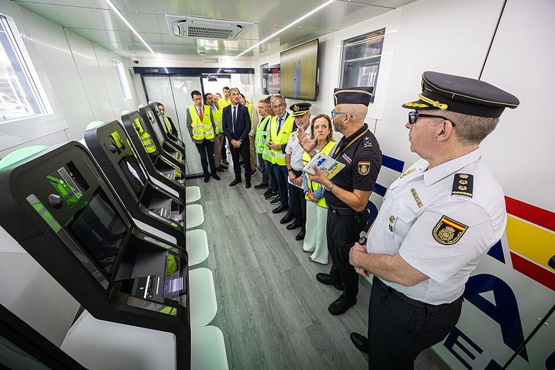 Spanish police officers beside self-service Entry/Exit System registration kiosks at the Port of Santander