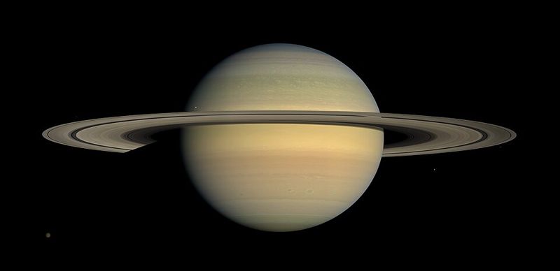 Saturn and its rings photographed by the Cassini spacecraft, showing the planet's slightly flattened round shape