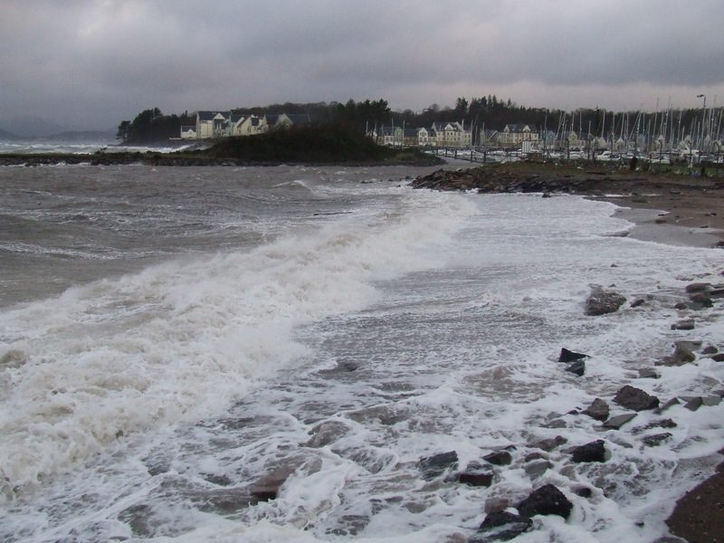 Storm waves crashing against the shore at Inverkip on the west coast of Scotland